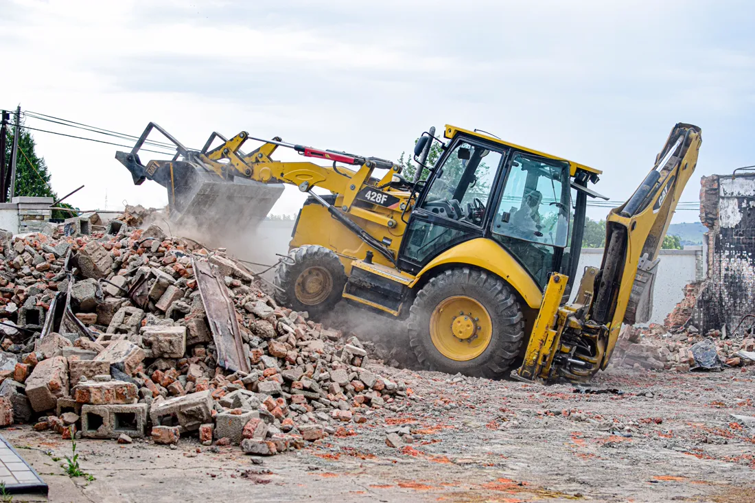 Demolition equipment clearing a site